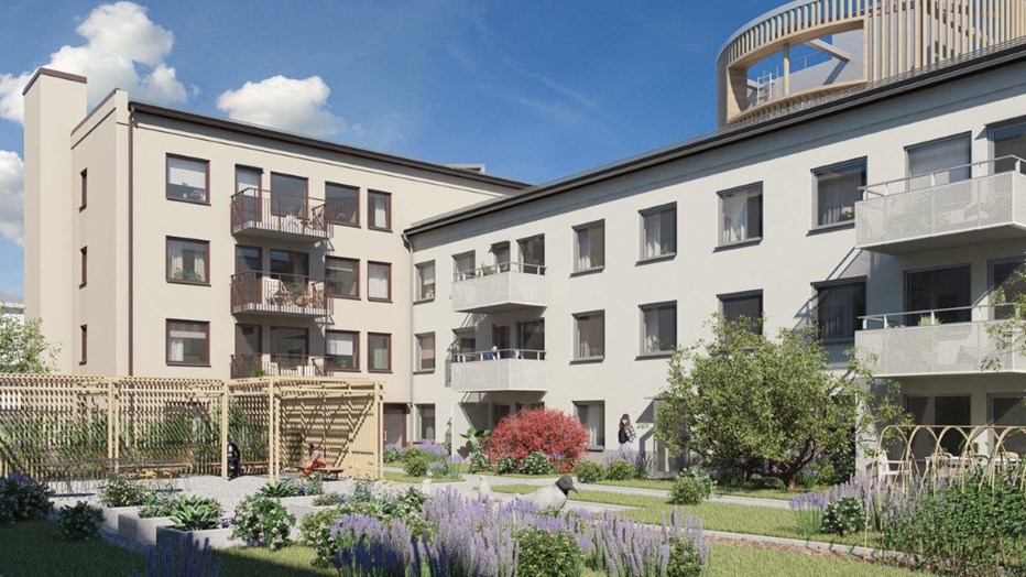 Innergård med egna odlingar och pergola som inbjuder till umgänge. Innergård med två byggnader i vinkel. Här syns odlingar, gräsmatta och träd samt en pergla.