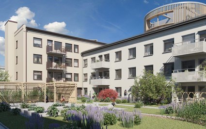 Innergård med egna odlingar och pergola som inbjuder till umgänge.