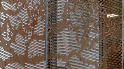 The gabels of the house have been covered with perforated metal sheets.