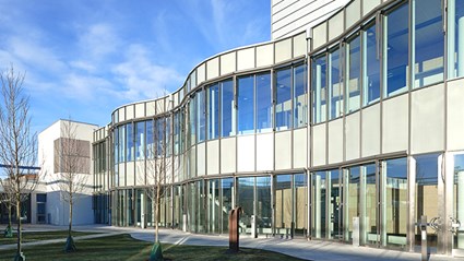 The facade is dominated by large glass surfaces. 
