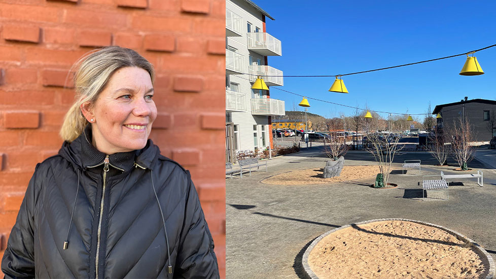 Pia Sanger Schröder lutar sig mot väggen till ett av de nya bostadshusen och blickar ut över Kvibergsstaden