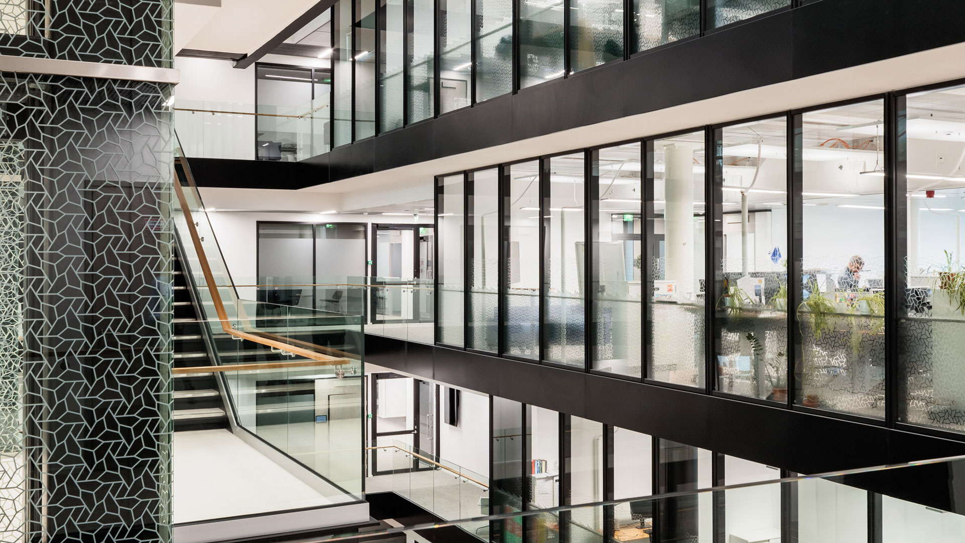 Asymmetrical pentagonal shape is degorating the building as outside than inside. The spape is visible e.g. in elevators and office walls.