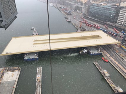 The bridge is towed and pulled closer to its final destination.