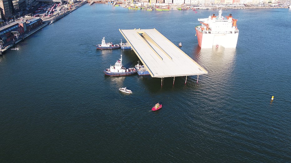 Towing the bridge to the quay. Towing the bridge to the quay.