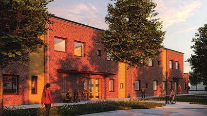 Fasaden mot gatan har en tydlig entré och inbjudande arkitektur.