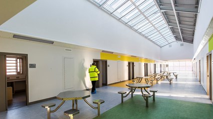 Light and bright communal space in a cell block at HMP Grampian