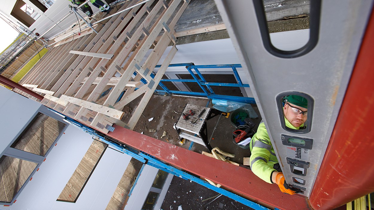 A man is working on a house