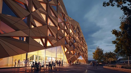The golden building gets its shimmer from metal cartridges and strings of light