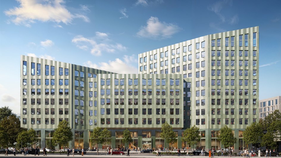 Olivin sett framifrån, kontorshus med grön zinkfasad och triangelformad design.
